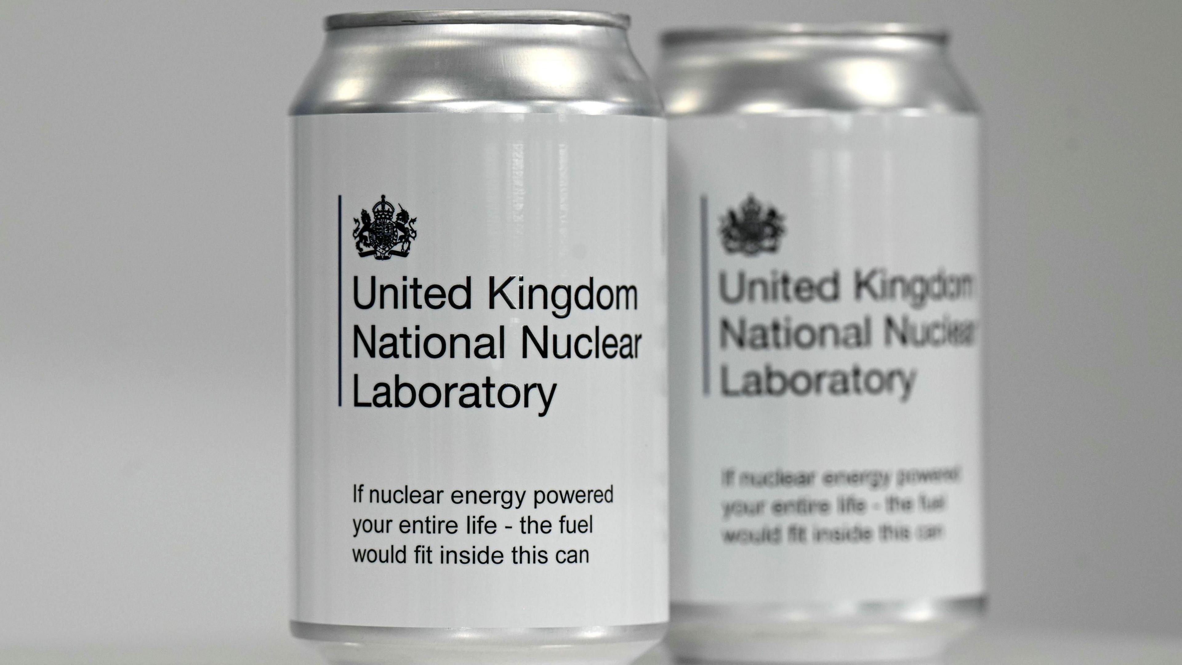 Two cans reading: "United Kingdom National Nuclear Laboratory" and "If nuclear energy powered your entire life - the fuel would fit inside this can"