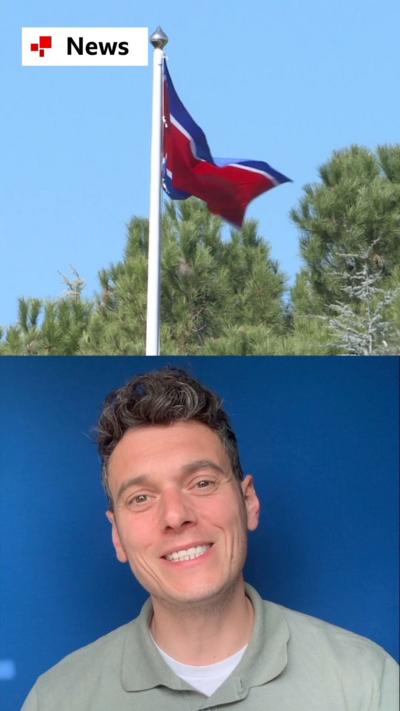 The BBC's Joe Tidy pictured beneath a North Korean flag in a split screen picture