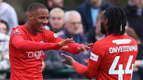 Richard Kone celebrates scoring a goal for Wycombe