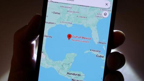 A phone with Google Maps open. On the map we can see the Gulf of Mexico, as bordered by the US, Mexico and Cuba.