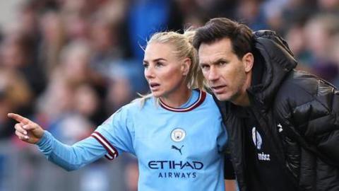 Alex Greenwood speaking to Manchester City Women's head coach Gareth Taylor