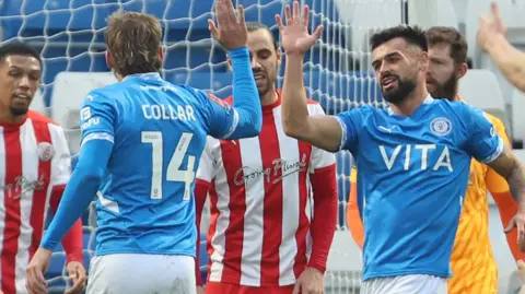 Stockport's Will Collar is congratulated for scoring against Brackley