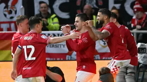 Anis Mehmeti celebrates scoring for Bristol City against Plymouth