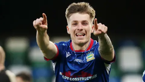 Chris McKee celebrates scoring for Linfield