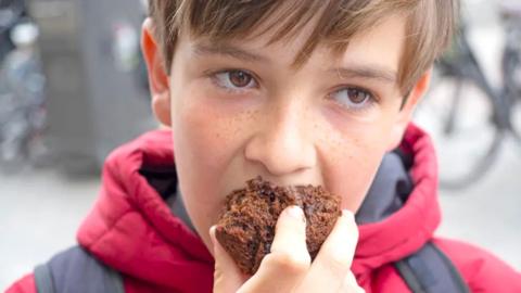 Boy eating cake