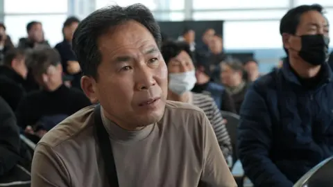 BBC/Hosu Lee Shin Gyu-ho, 64, spoke to the BBC from Muan International Airport