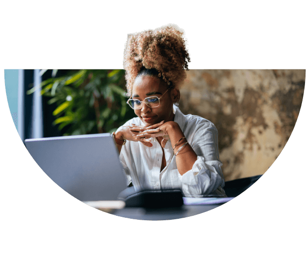 Girl wearing glasses looking at her laptop