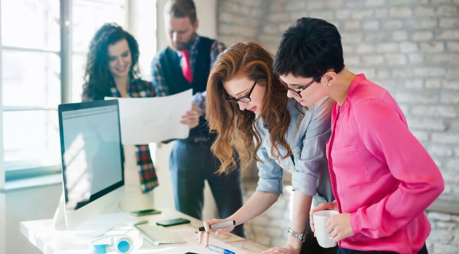 Multiple professionals working on a project together