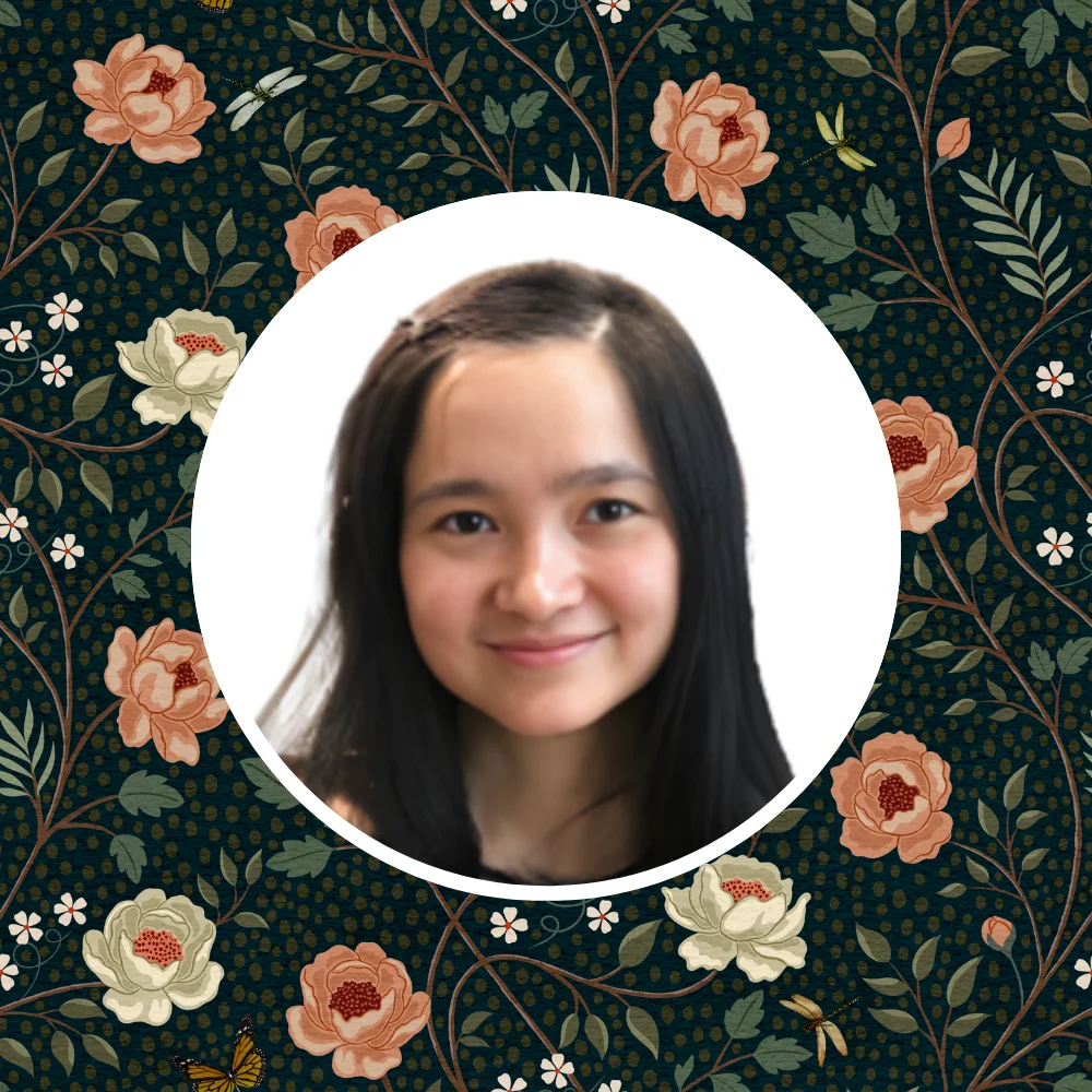 Loan Tran in front of one of her floral designs