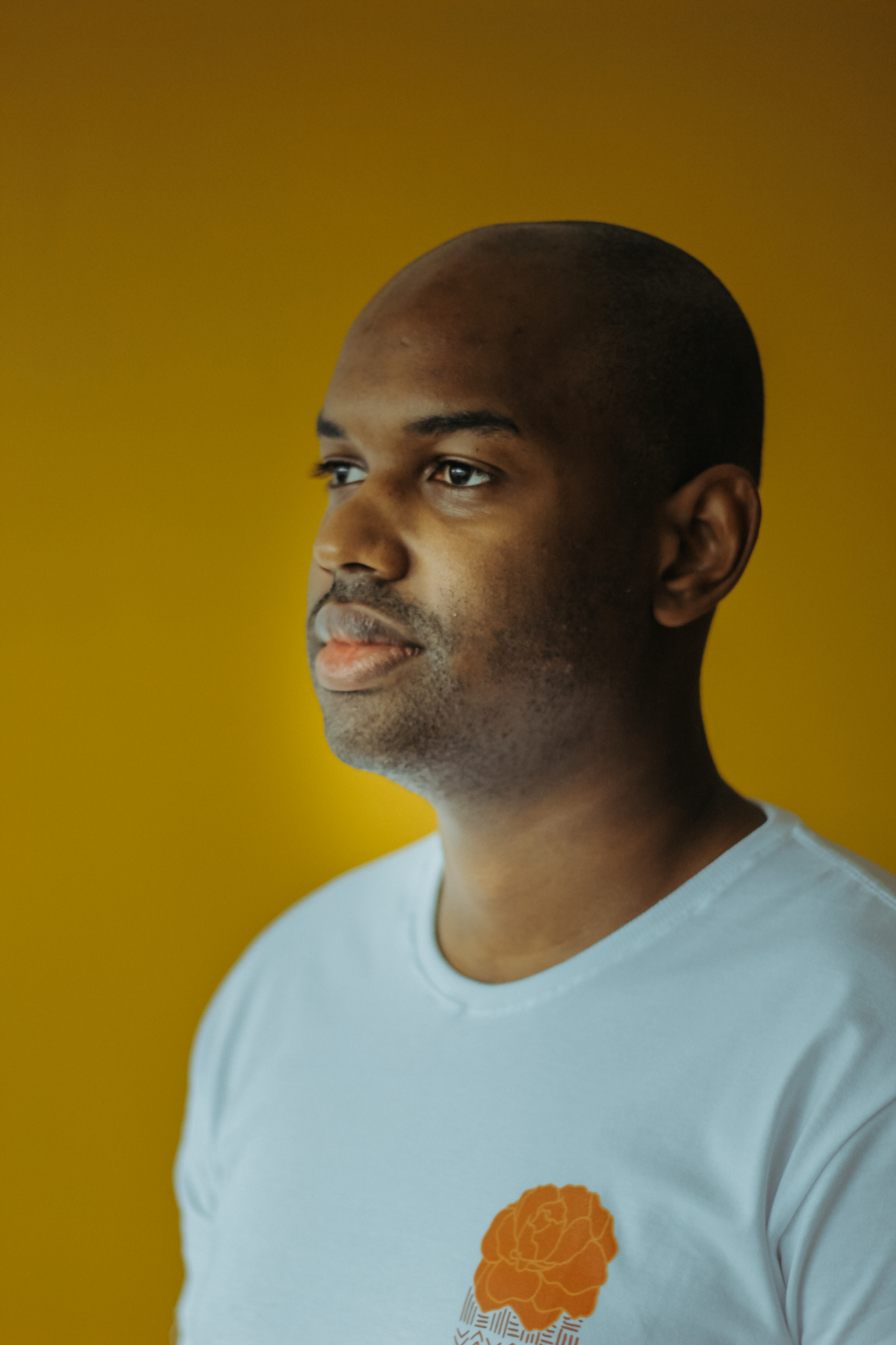 Author Felipe against a yellow backdrop