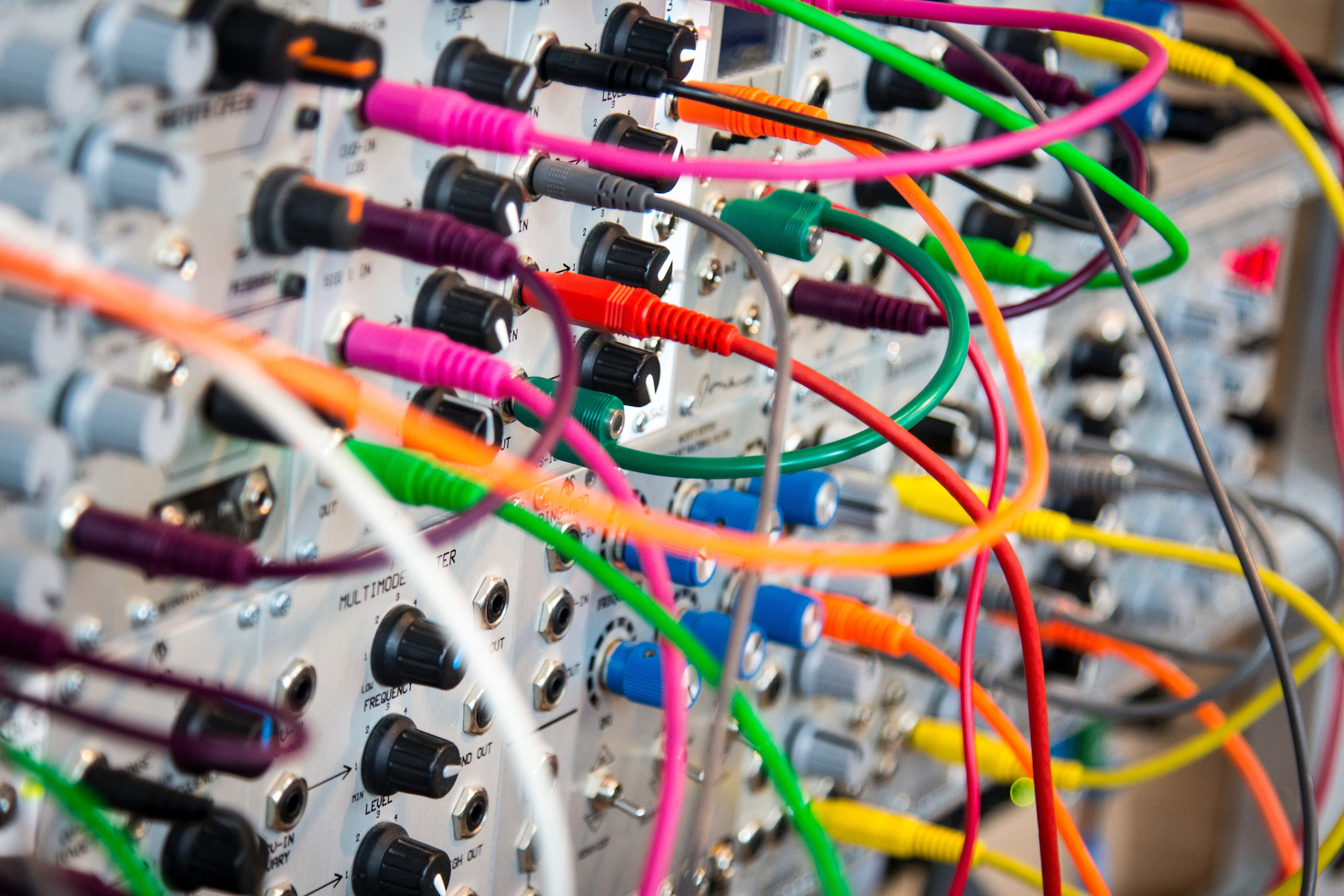 Wires of all different colors plugged into a machine