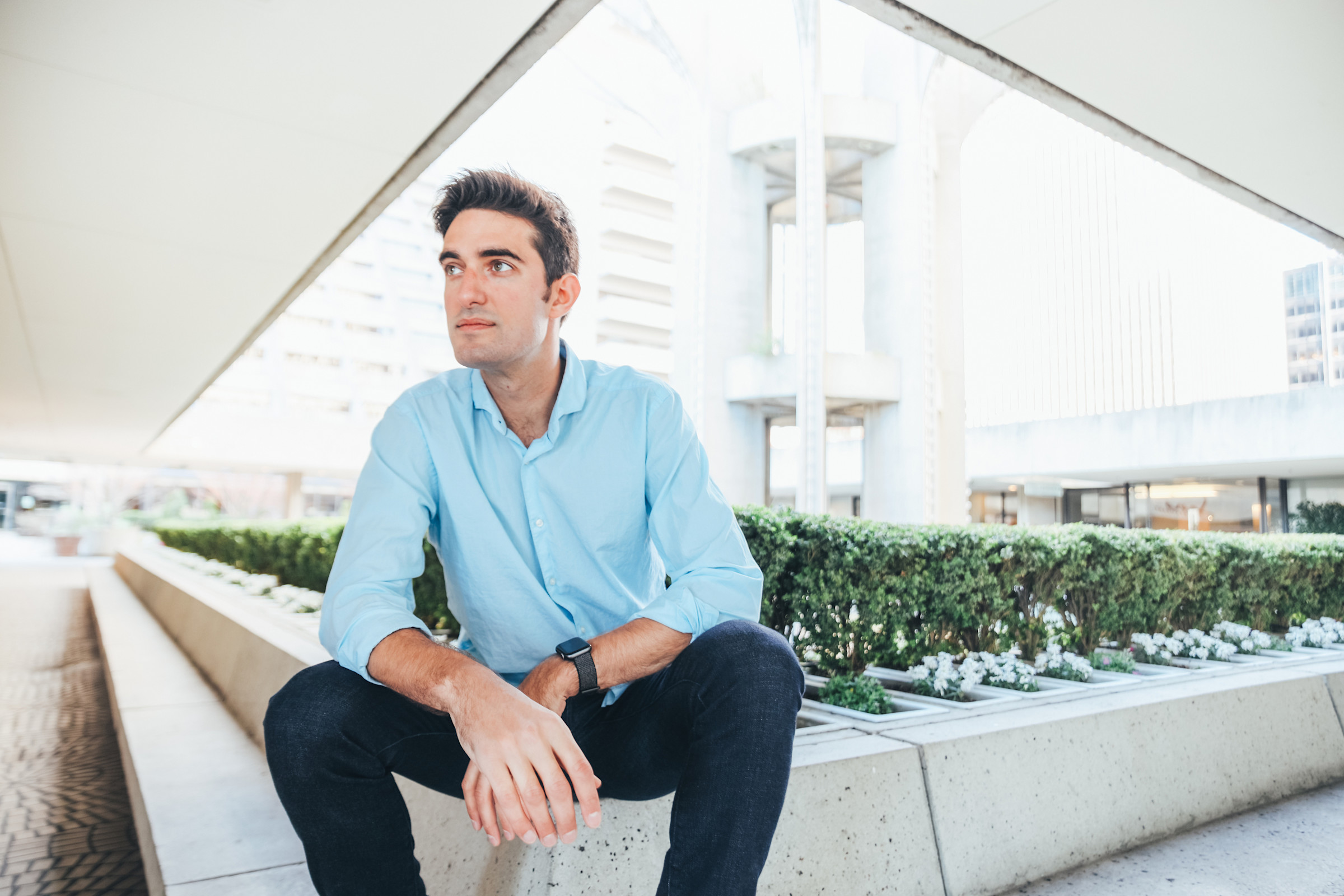 Author Feross sitting outside in an urban outdoor space