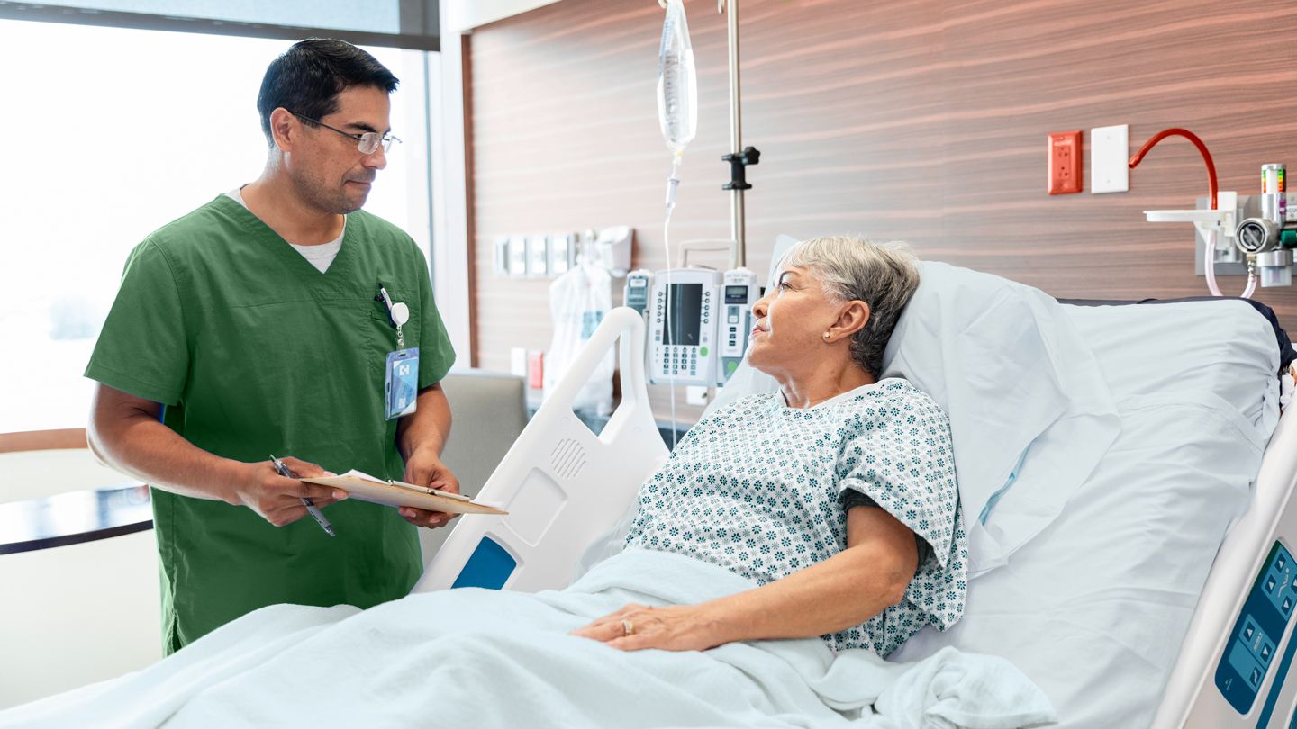 doctor talking with patient before surguery