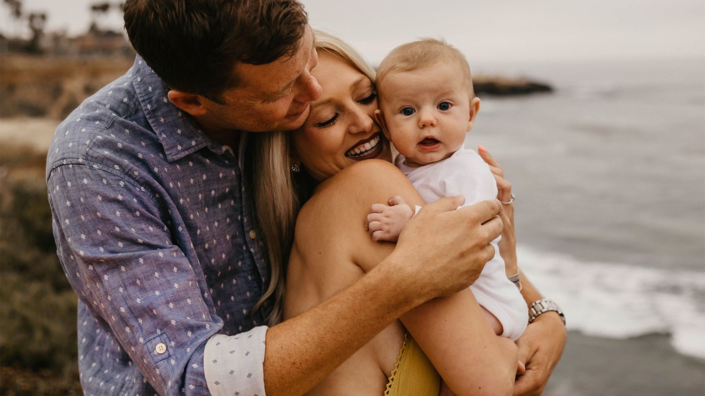 young family at the beach