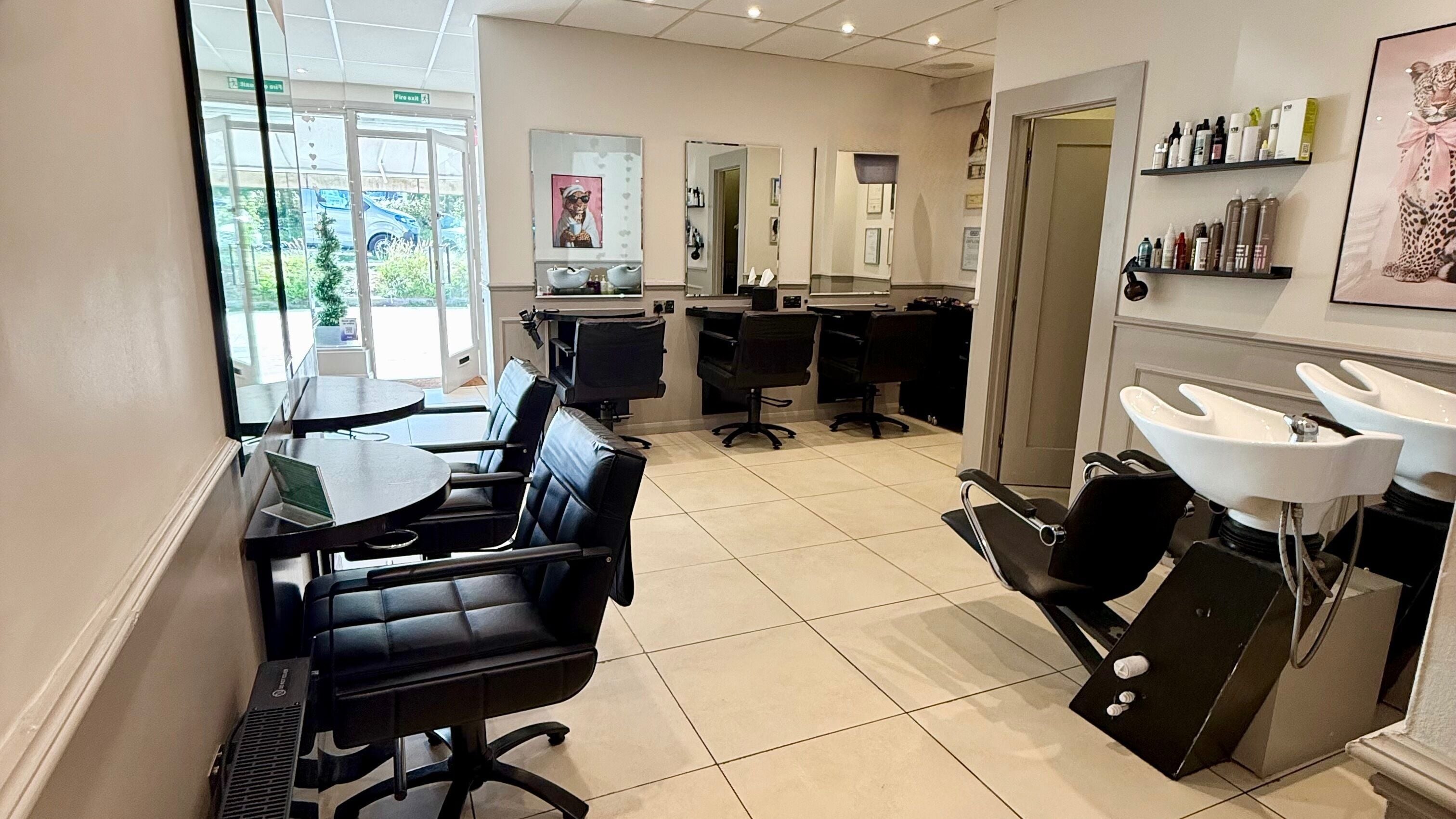 Modern salon interior at Hagon Hair & Beauty Ltd in Brighton And Hove, England, GB with chic styling chairs.