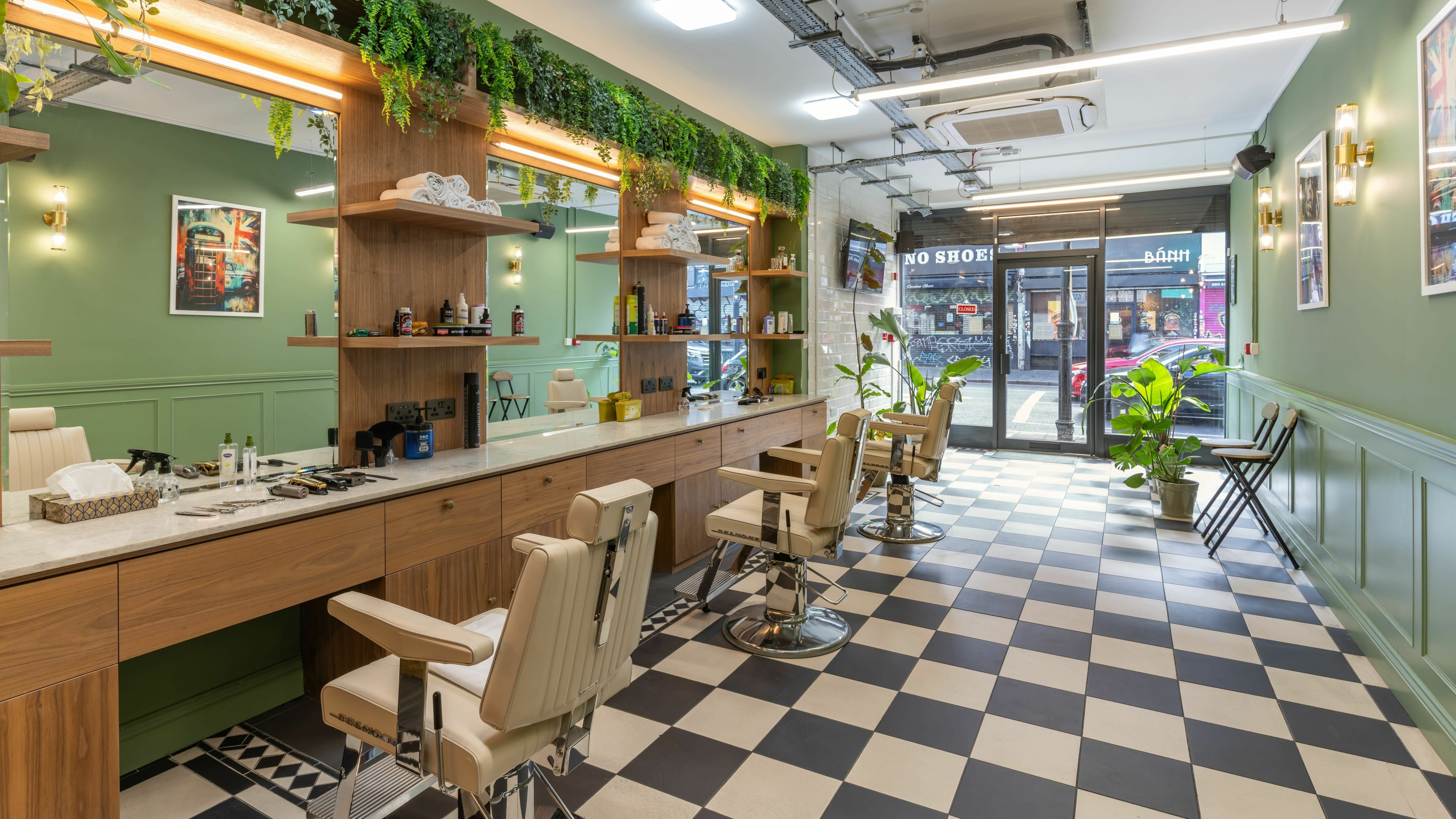 Interior of The Axe Club - Dalston in London, England, GB, showcasing stylish barber chairs and modern decor.