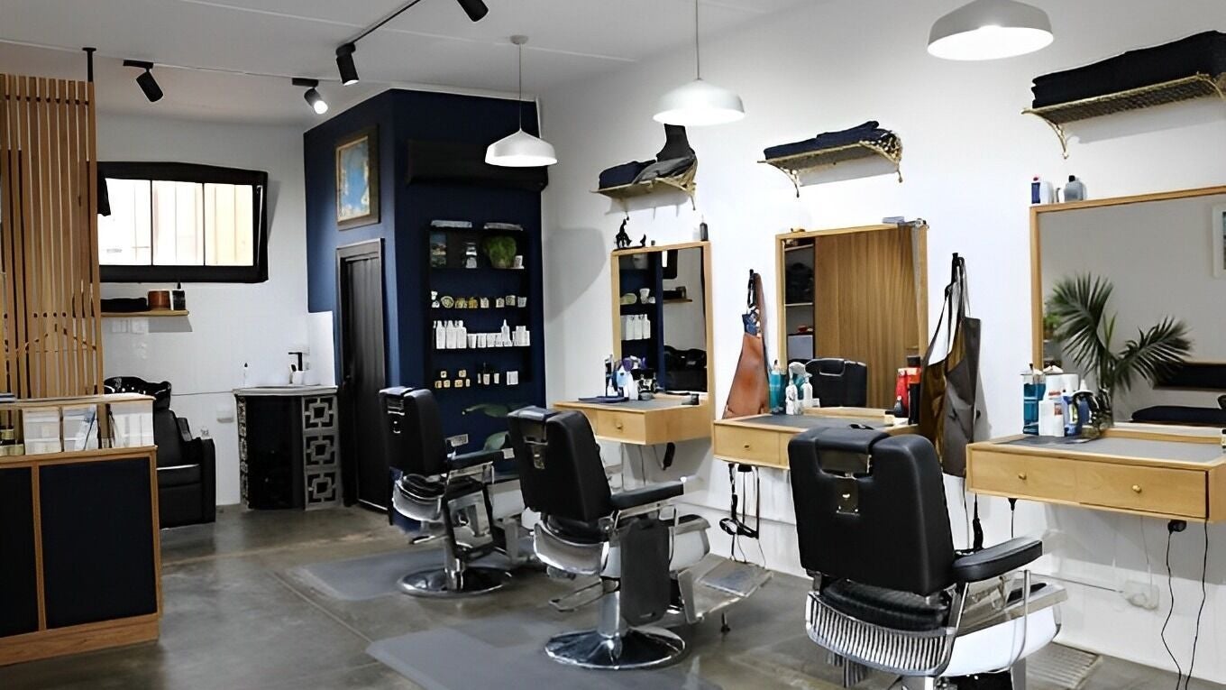 Stylish interior of The Conductor Barbershop Carnegie, featuring chic barber chairs in Carnegie, VIC, AU.