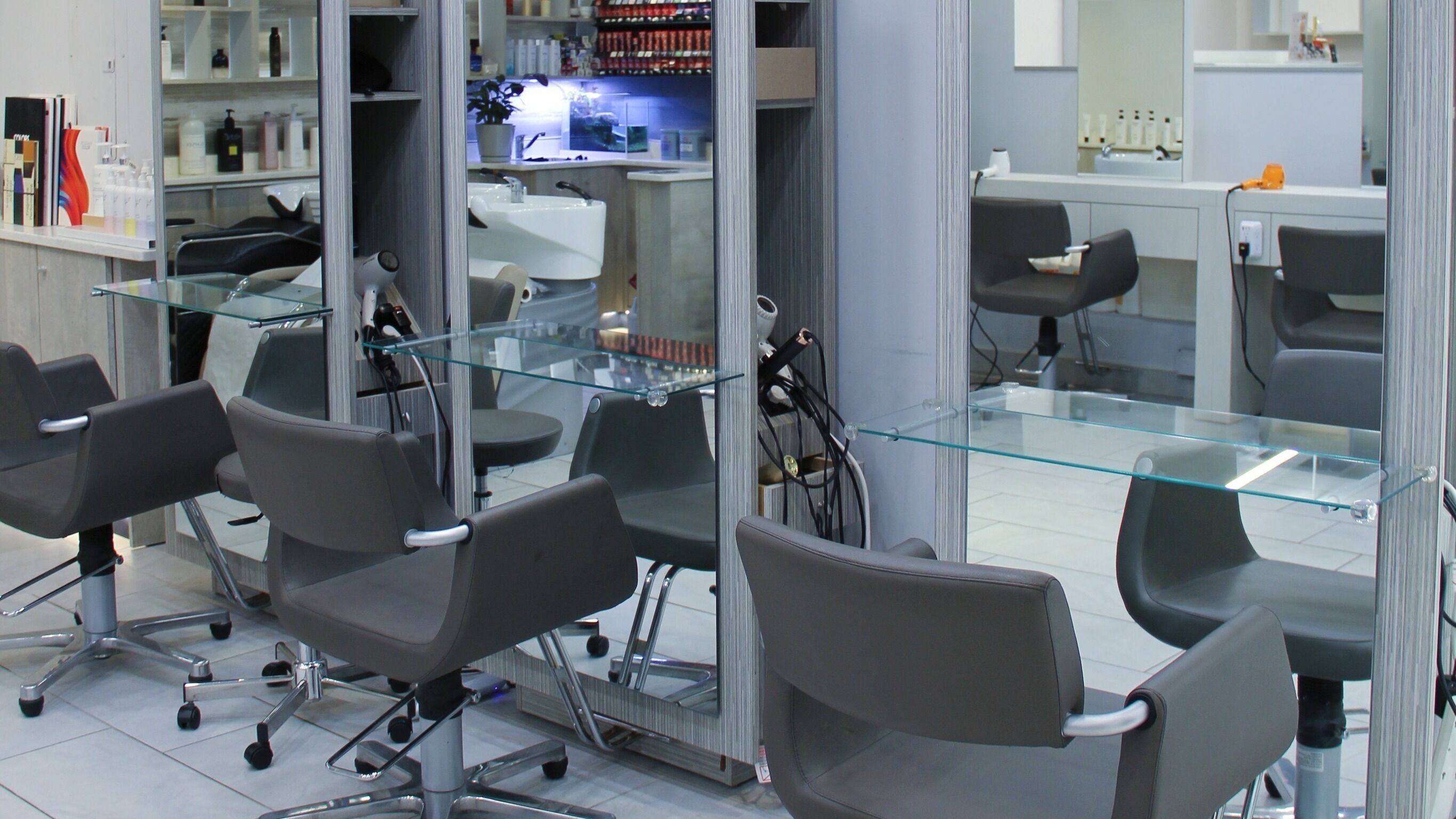 Modern styling chairs and mirrors at Nova Salon in New York, New York, US offering premium beauty services.