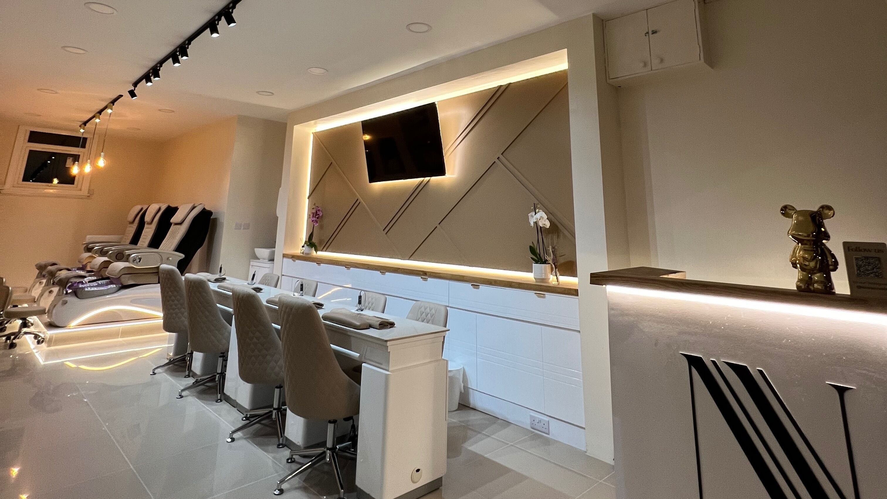 Modern interior of Nicoya Nails in London, England, GB showcasing luxurious nail care stations.