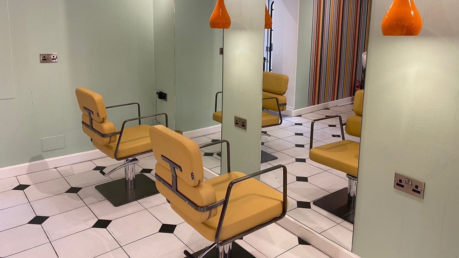 Chic salon chairs at Alberto's Hair, a top beauty spot in London, England, GB, with unique decor.