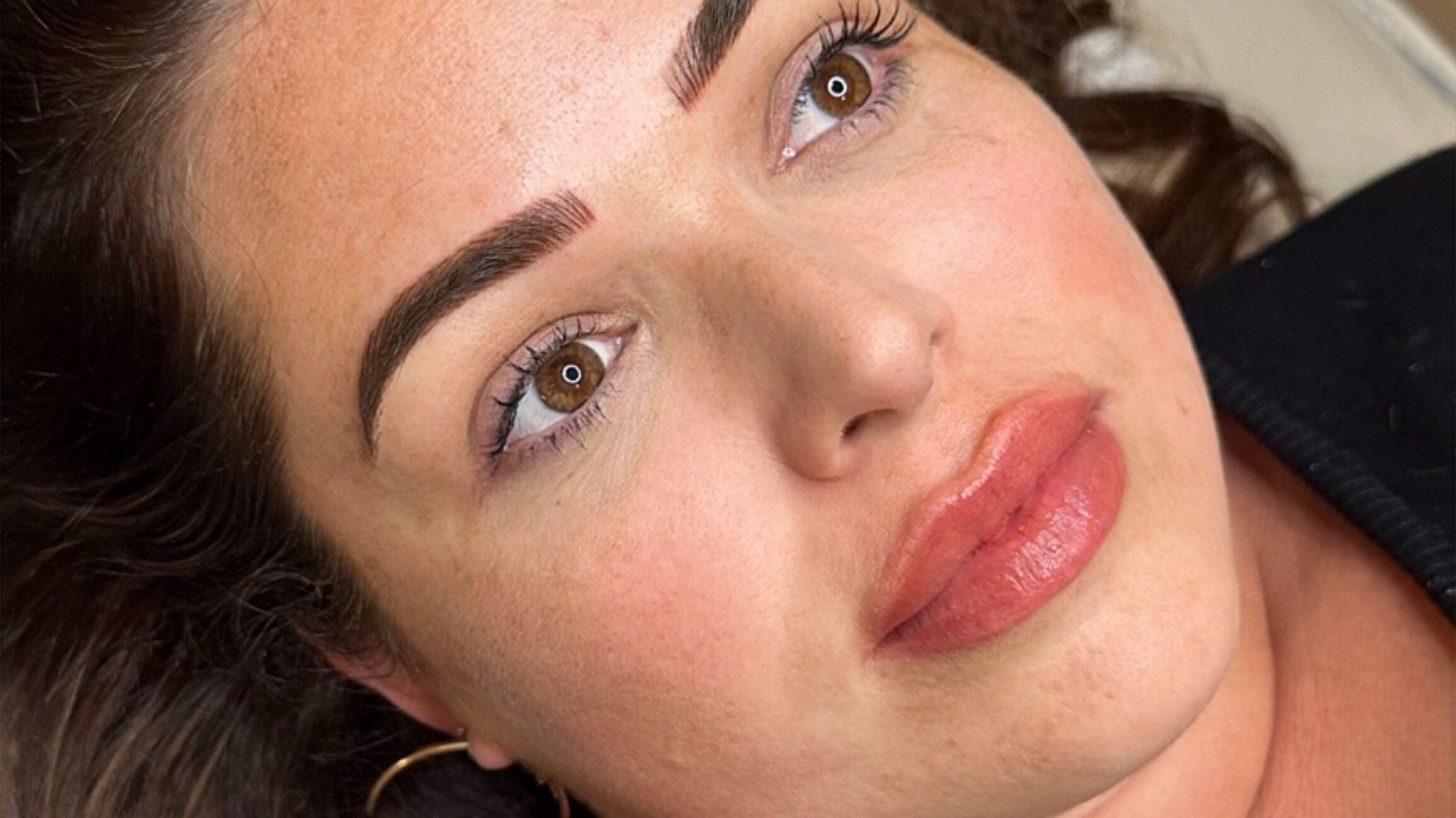 Close-up of cosmetic tattooed eyebrows at Monarch Cosmetic Tattoo, Albion, Queensland, AU. Natural and defined look.