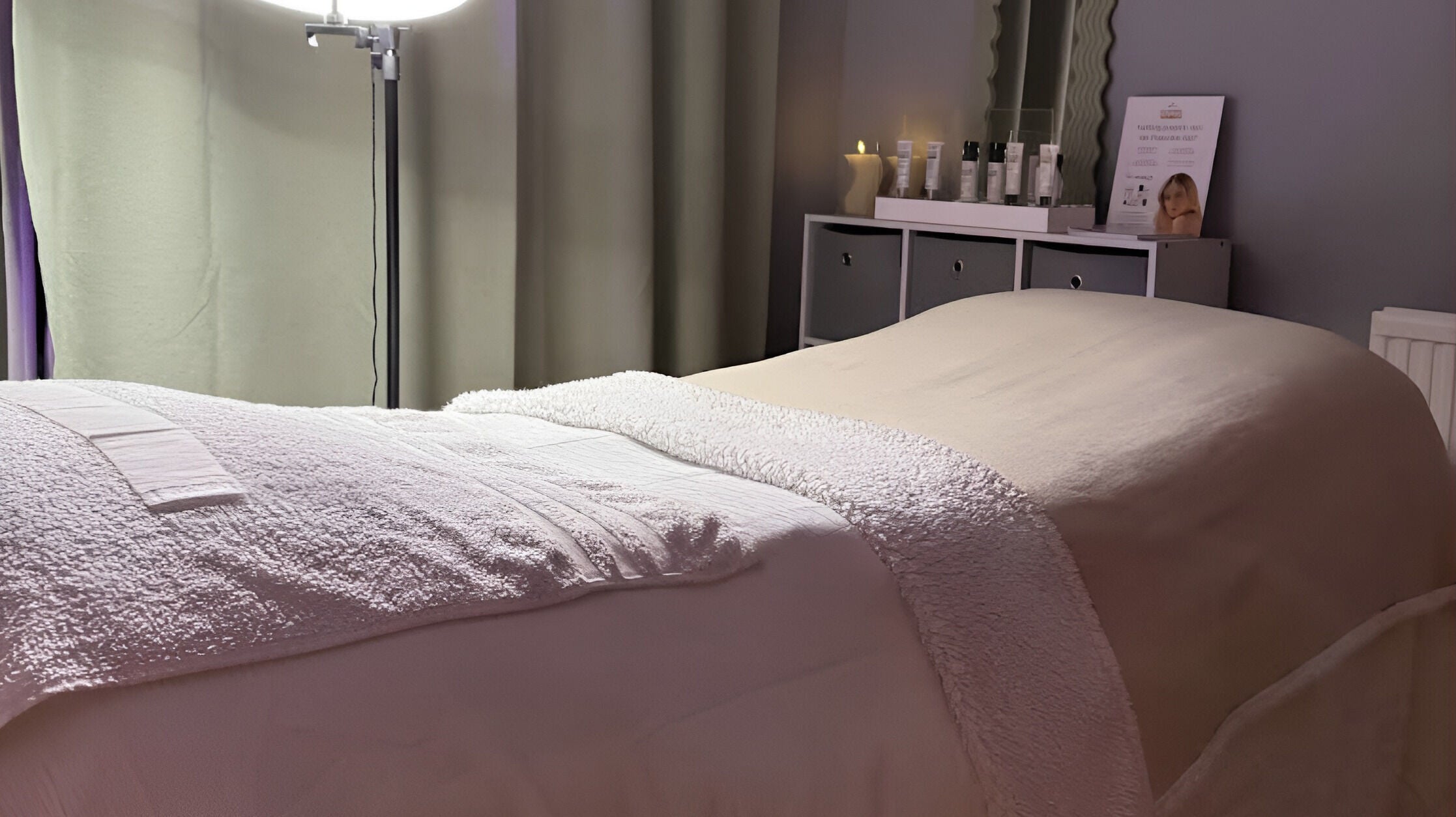 Relaxing spa bed setup at After Glow by Liv in Worsley, England, GB with cozy lighting and soothing ambiance.