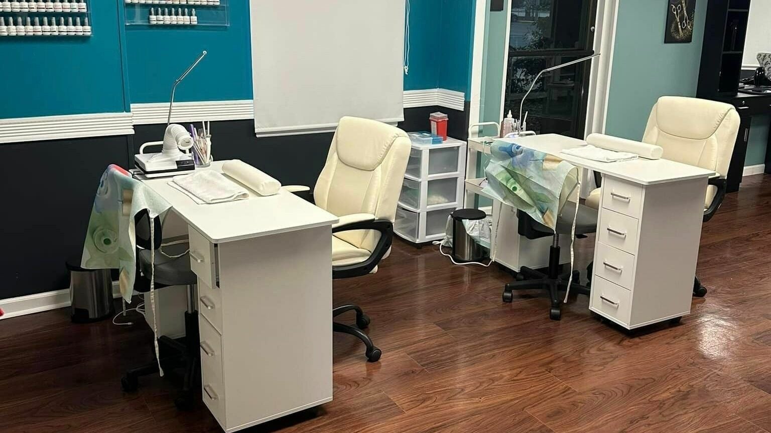 Chic nail stations at Glitteratti Salón Florida in Ormond Beach, Florida, US showcasing modern decor.