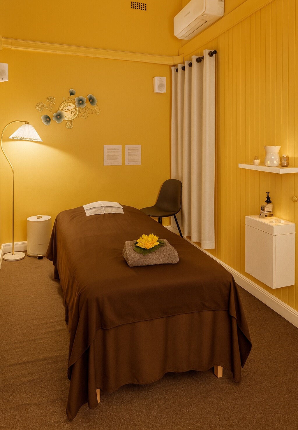 Anda Thai Massage (Balwyn) tranquil room in Melbourne, Victoria, AU with a bed and serene decor.