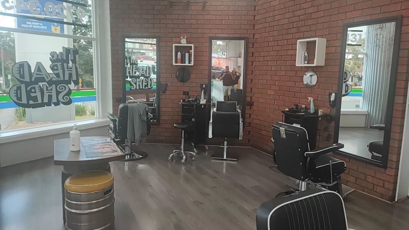 Modern salon chairs and mirrors at The Head Shed in Heathmont, VIC, AU showcasing a stylish atmosphere.