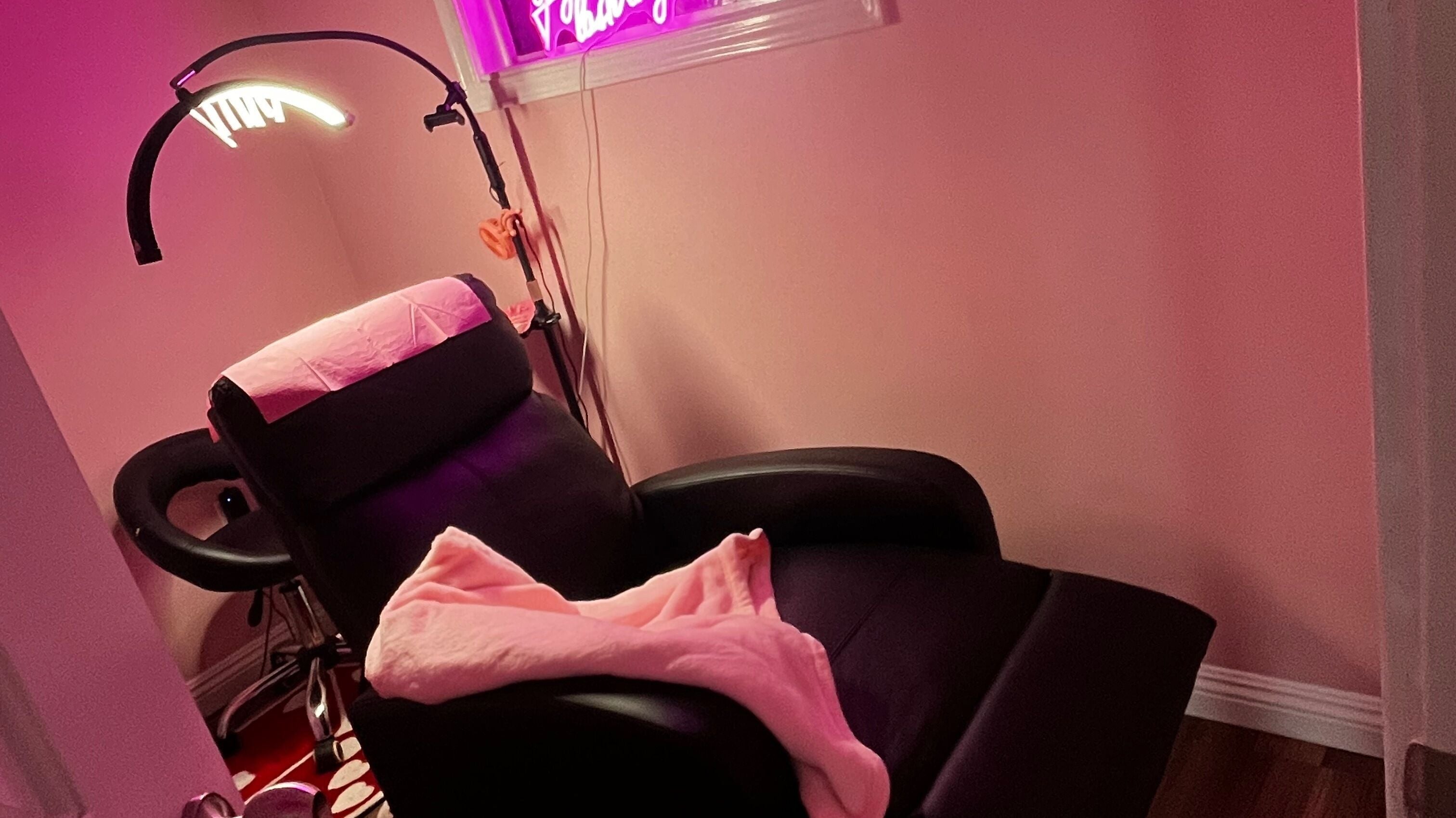Inviting lash extension chair in Lash Extensions, Whittier, California, US with pink lighting.