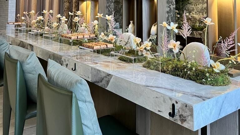 Elegant floral arrangement on marble counter at Tones Beauty, Jeddah, Makkah Province, SA.