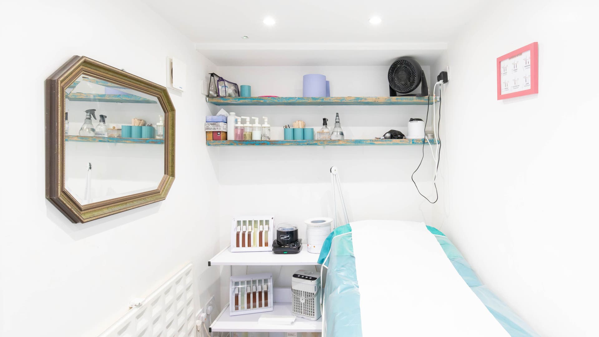 Cozy waxing room at My Brazilian Wax Holloway, London, England, GB, showcasing serene and organized setup.