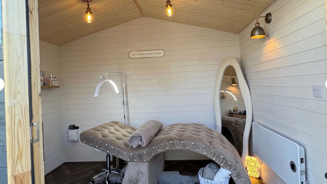 Beautiful interior of Fall From Grace Studio in Hull, GB, showcasing a serene treatment room with elegant decor.