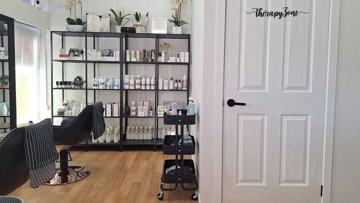 Calm interior of K Scalp Care & Head Spa in Melbourne, Victoria, AU with shelves of beauty products.