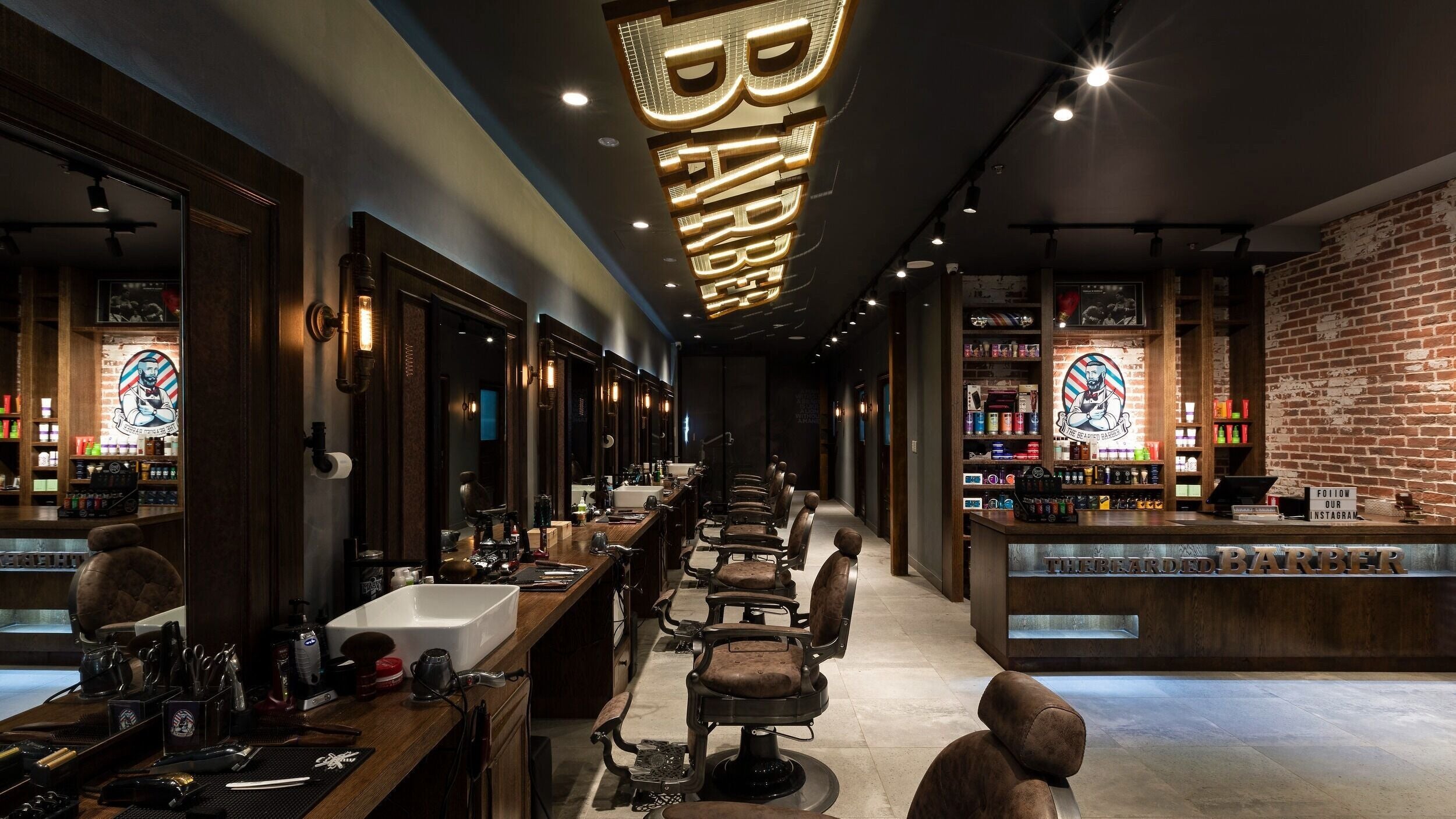 Interior of The Bearded Barber Miranda in New South Wales, AU with classic barber chairs and sleek decor.