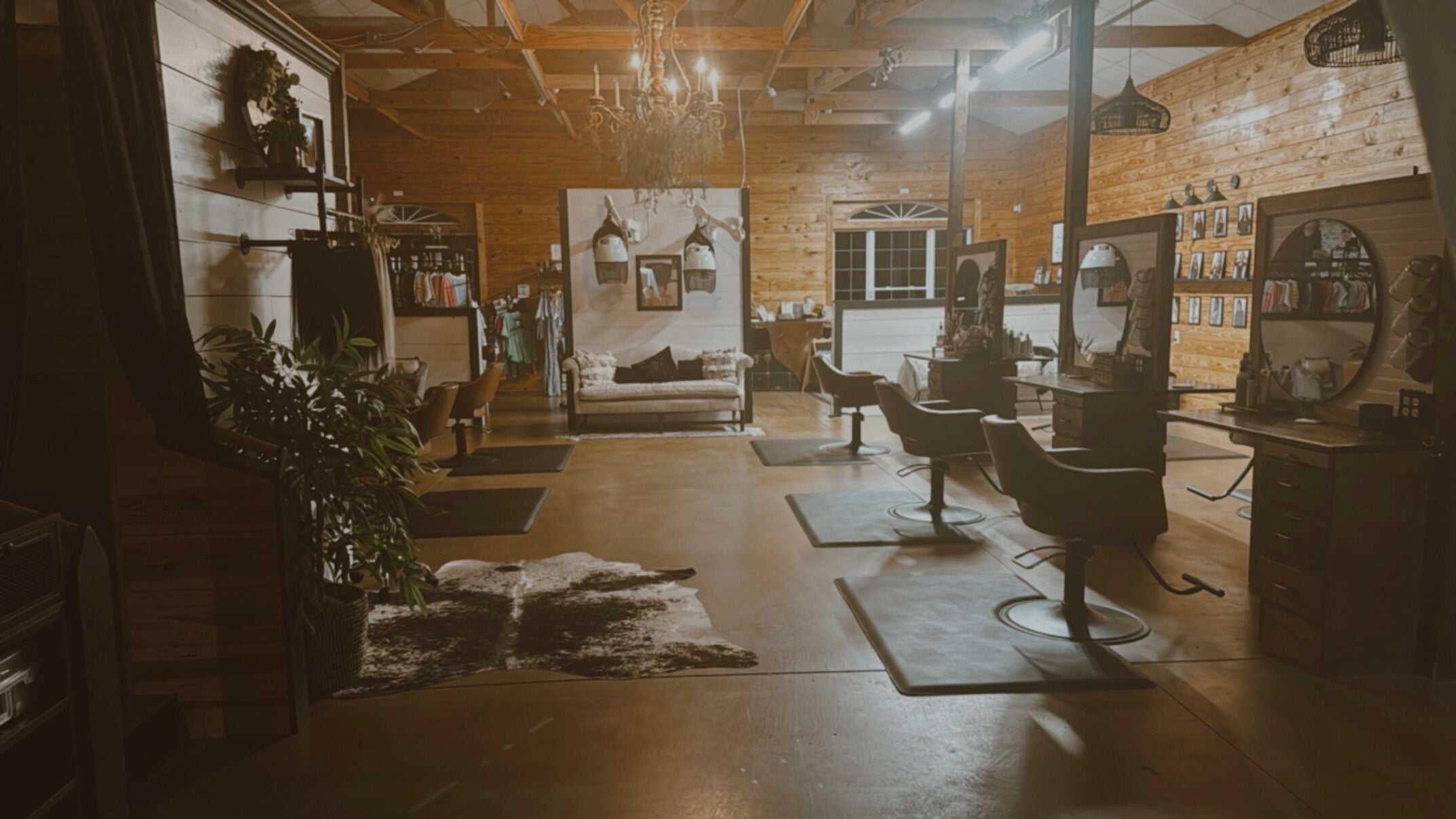 Warm, rustic interior of Meraki & Co. Salon & Spa in Greer, South Carolina, US with elegant wooden decor.