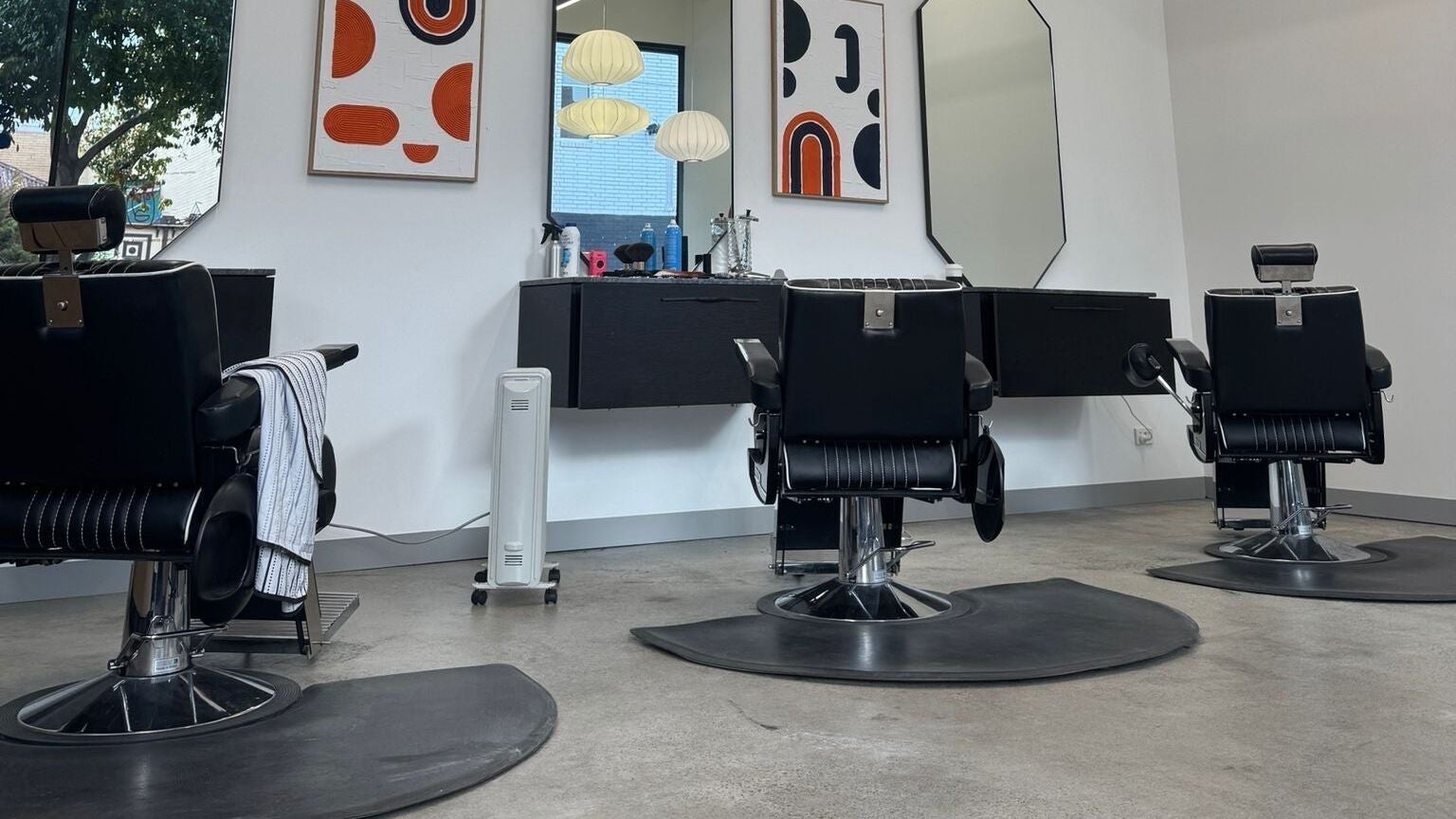 Modern salon chairs and decor at 3121 Studio, Melbourne, Victoria, AU, showcasing contemporary design and elegance.