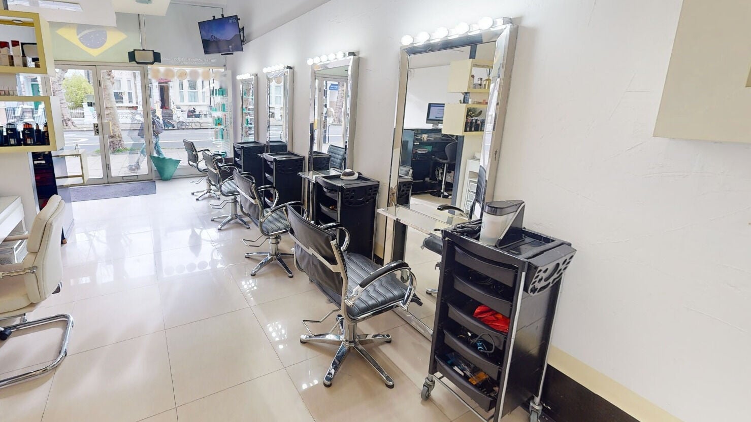 Modern styling chairs and mirrors at Da Silva Hair & Beauty in London, England, GB.