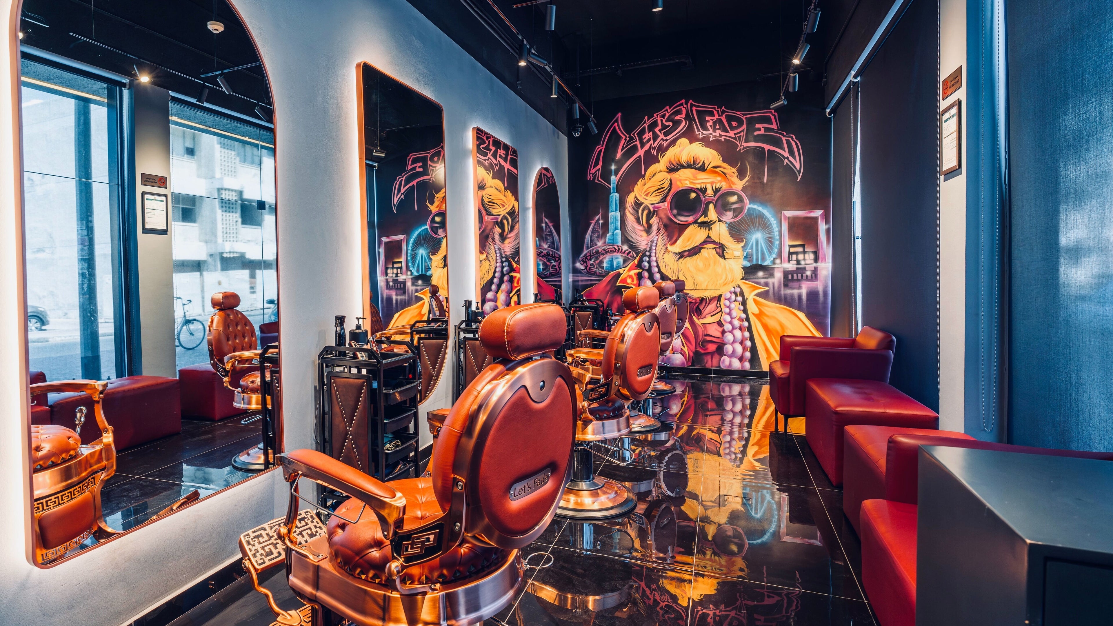 Modern barber shop at Let's Fade Bespoke in Dubai, Dubai, AE, featuring stylish chairs and vibrant art.