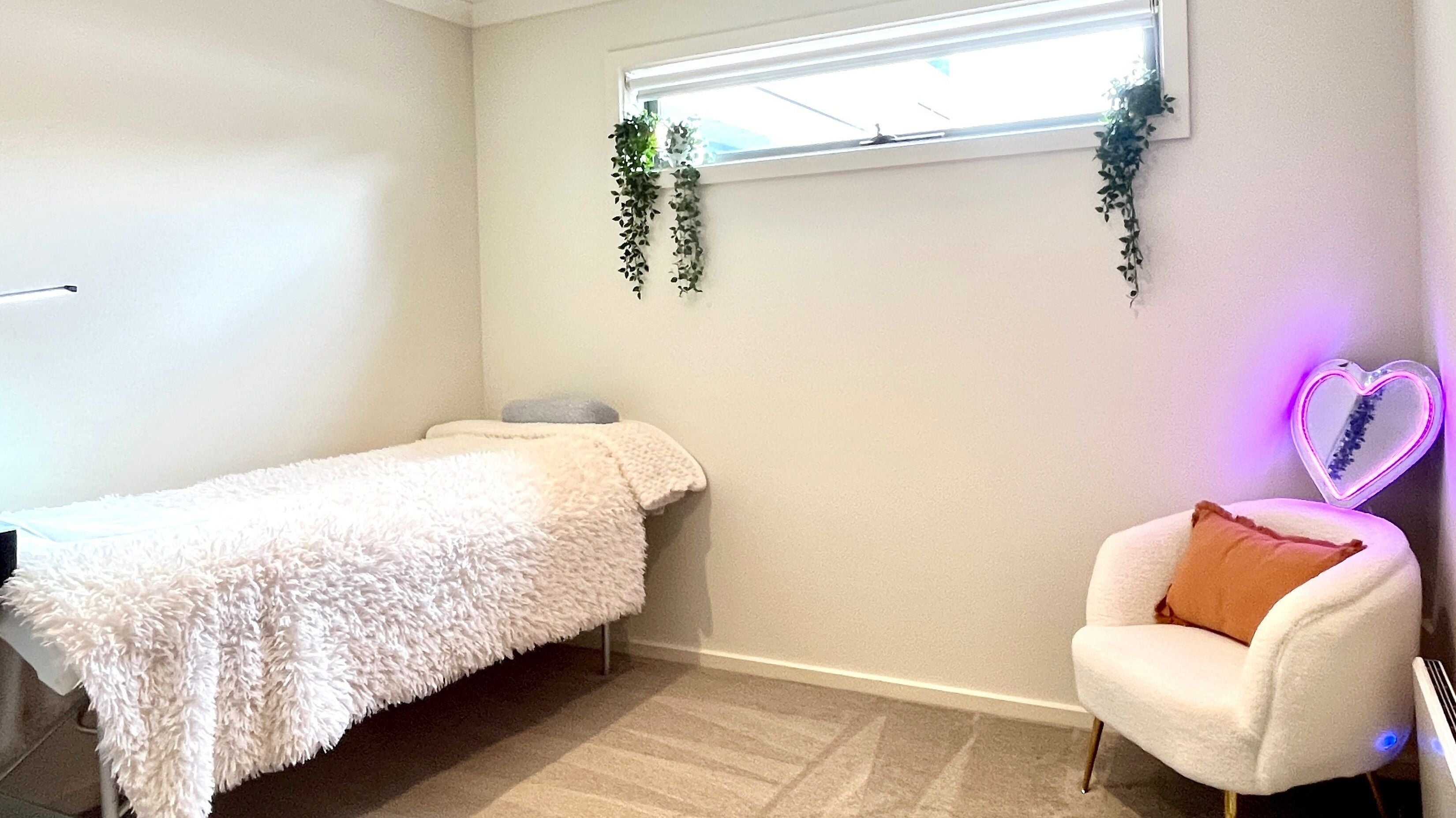 Cozy treatment room at Bayside Lashes Studio, Melbourne, Victoria, AU, featuring a plush bed and calming decor.
