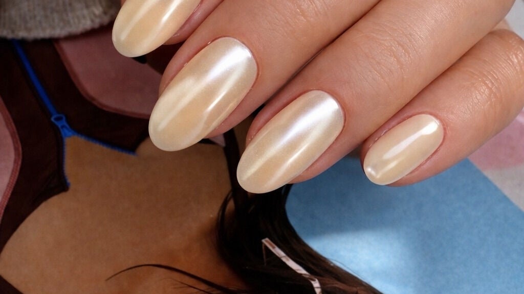 Elegant pearl polished nails at Freza Nail Studio, Lincolnshire, Illinois, US.