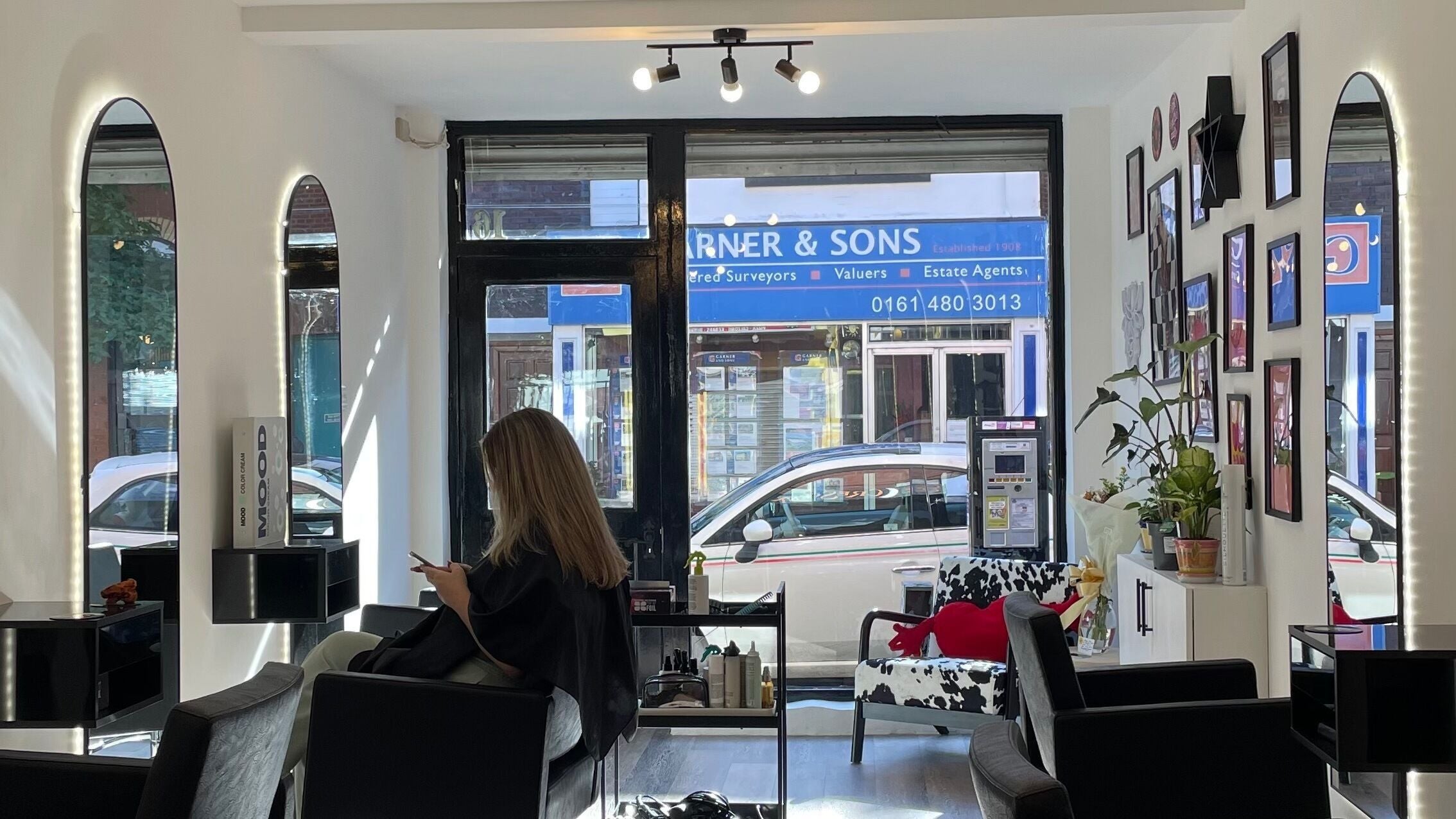 Modern interior of The Crescent Hair Studio in Stockport, England, GB, showcasing sleek decor and styling chairs.