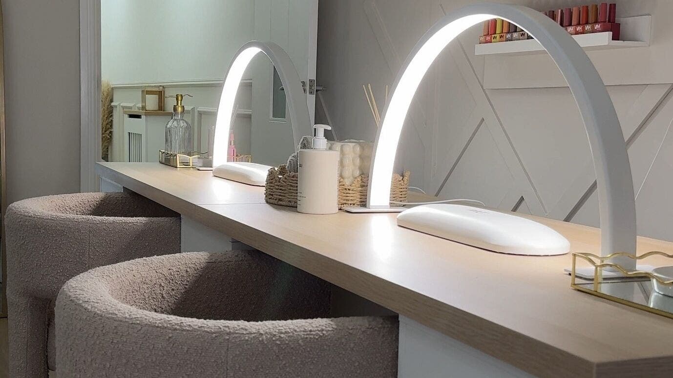 Modern nail station at E Elegance & Co., Paisley, Scotland, GB, featuring chic design and ambient lighting.