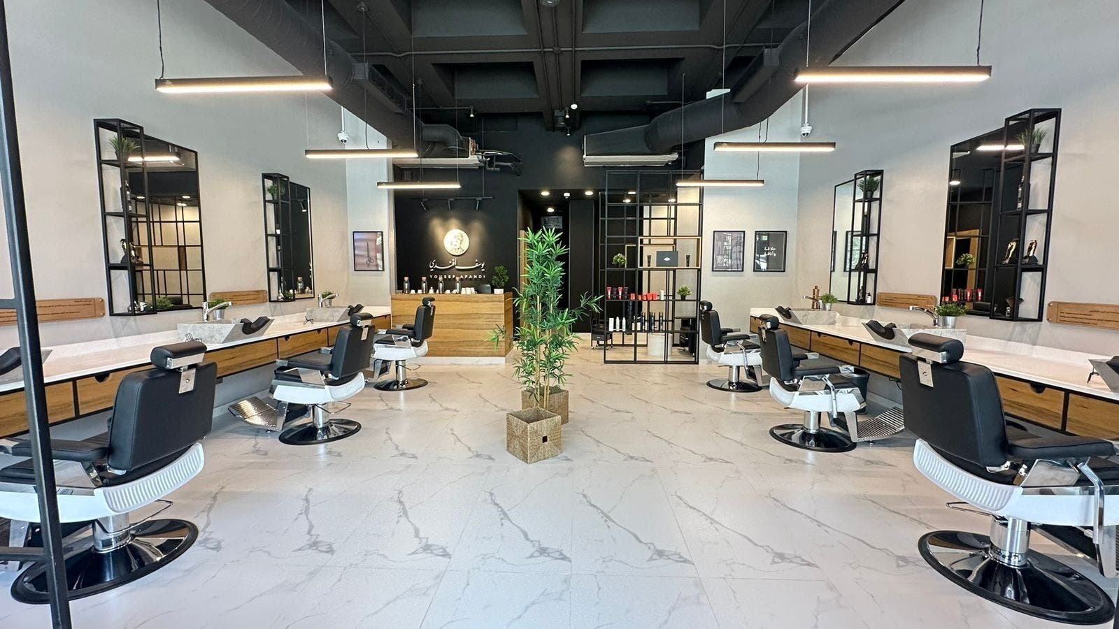 Sleek interior of Yousef Afandi Barbershop - Al Rabwa, Riyadh, Riyadh Province, SA with modern barber chairs.