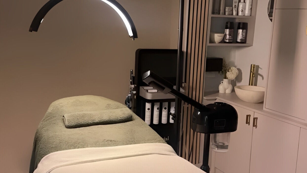 Elegant treatment room at Lana Aesthetic London, London, England, GB showcasing a plush massage table and modern decor.