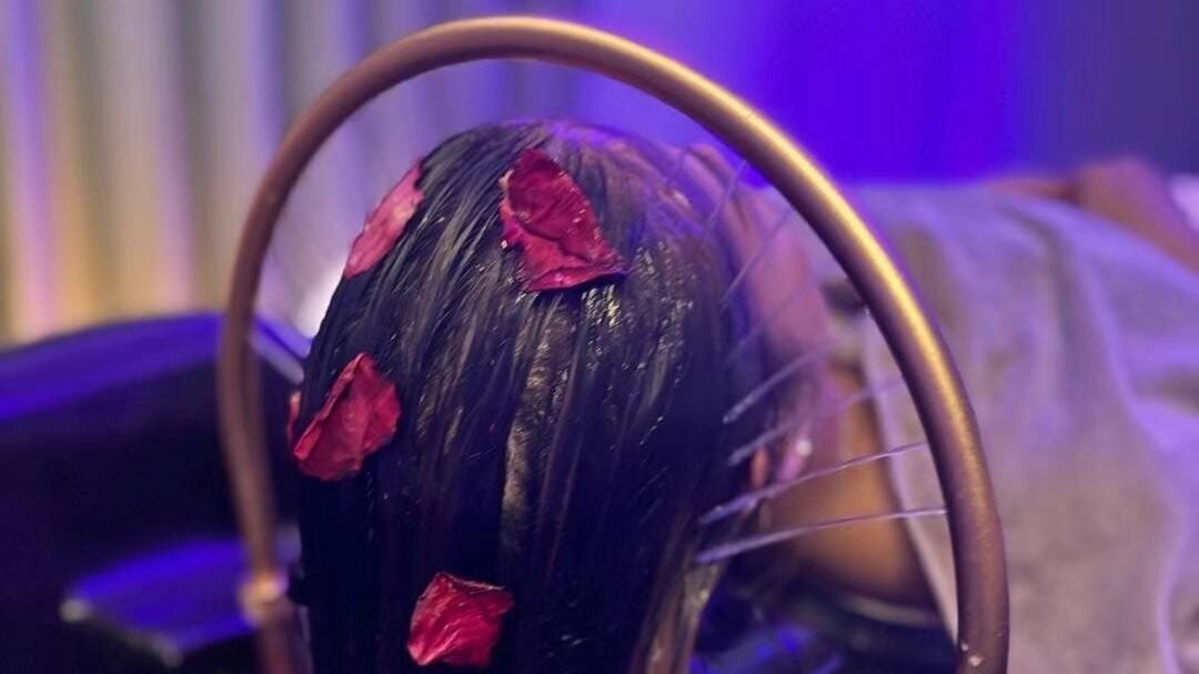 Relaxing spa treatment with rose petals at Am Perfect Spa in Aurora, Illinois, US, enhancing wellness.