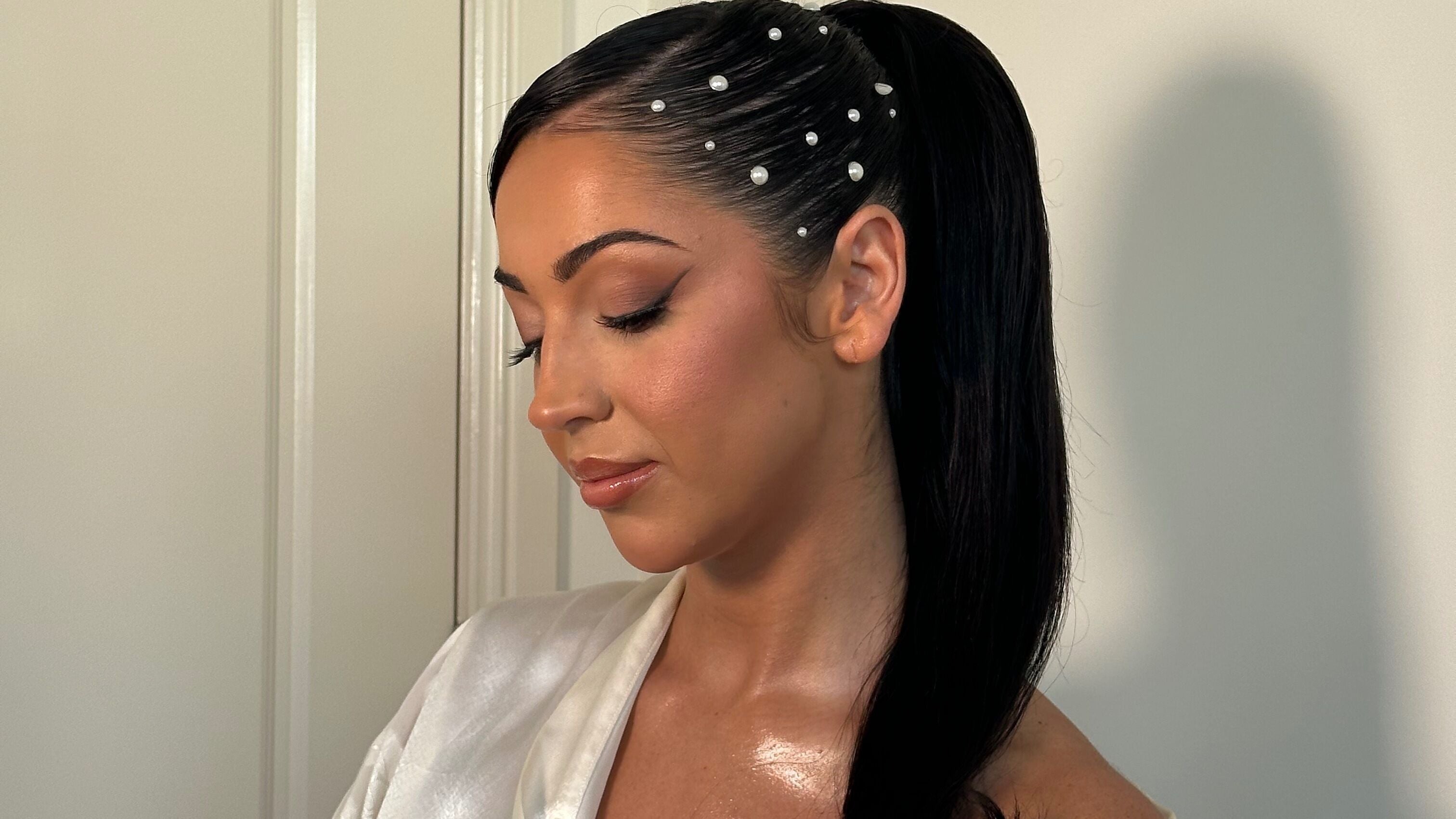 Elegant hairstyle with pearls at Issabella Stylist, Prahran, Victoria, AU. Perfect for formal events.
