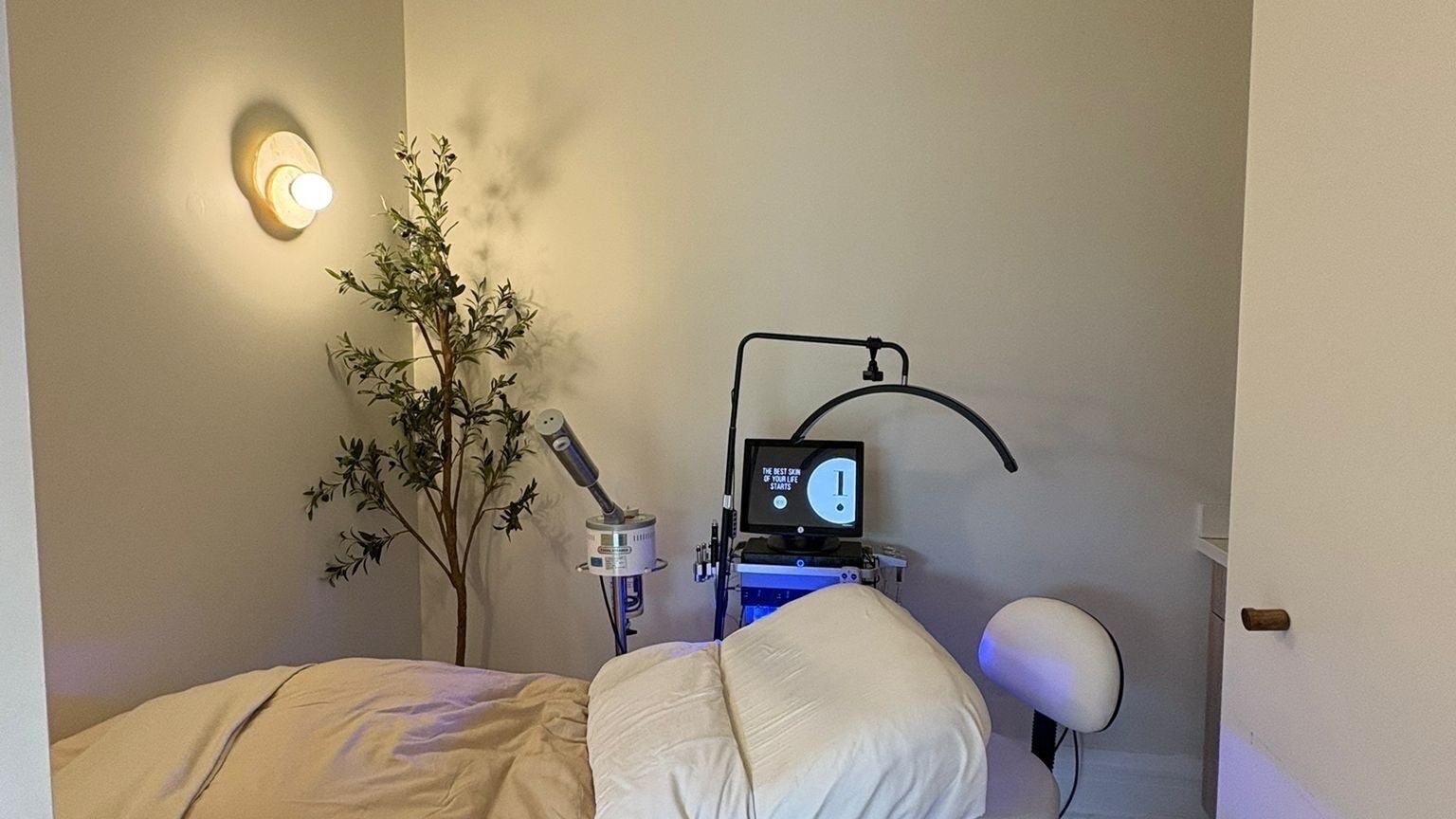 Relaxing spa room at Let’s Be Clear, Brampton, Ontario, CA with a treatment bed and soothing decor.