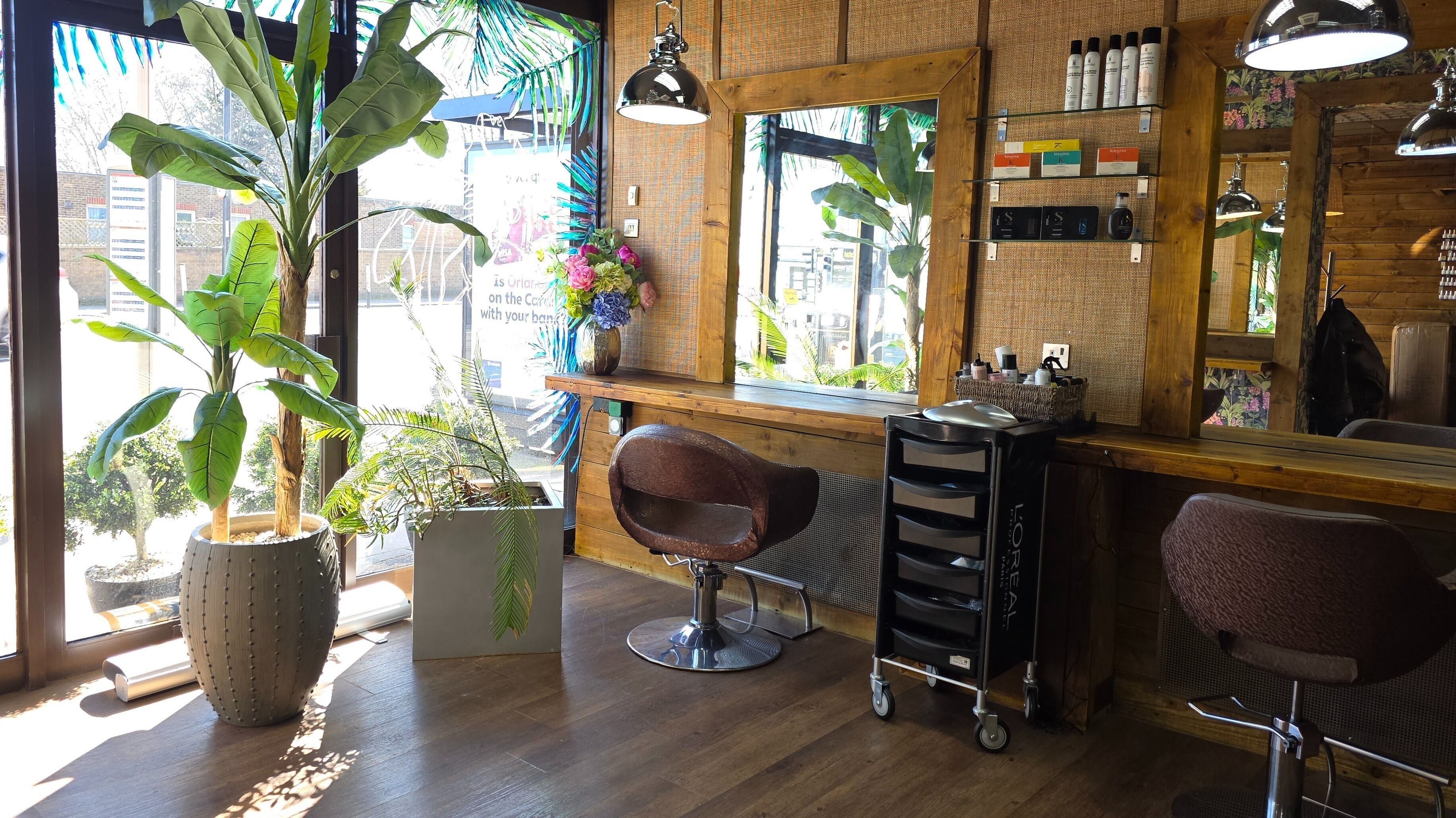 Modern salon interior at Head Hunters Hair and Beauty, London, England, GB with chic decor and styling chairs.