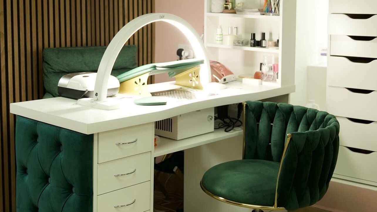 Elegant manicure station at Clover Beauty Studio Limited in Ennis, County Clare, IE, featuring plush green seating.